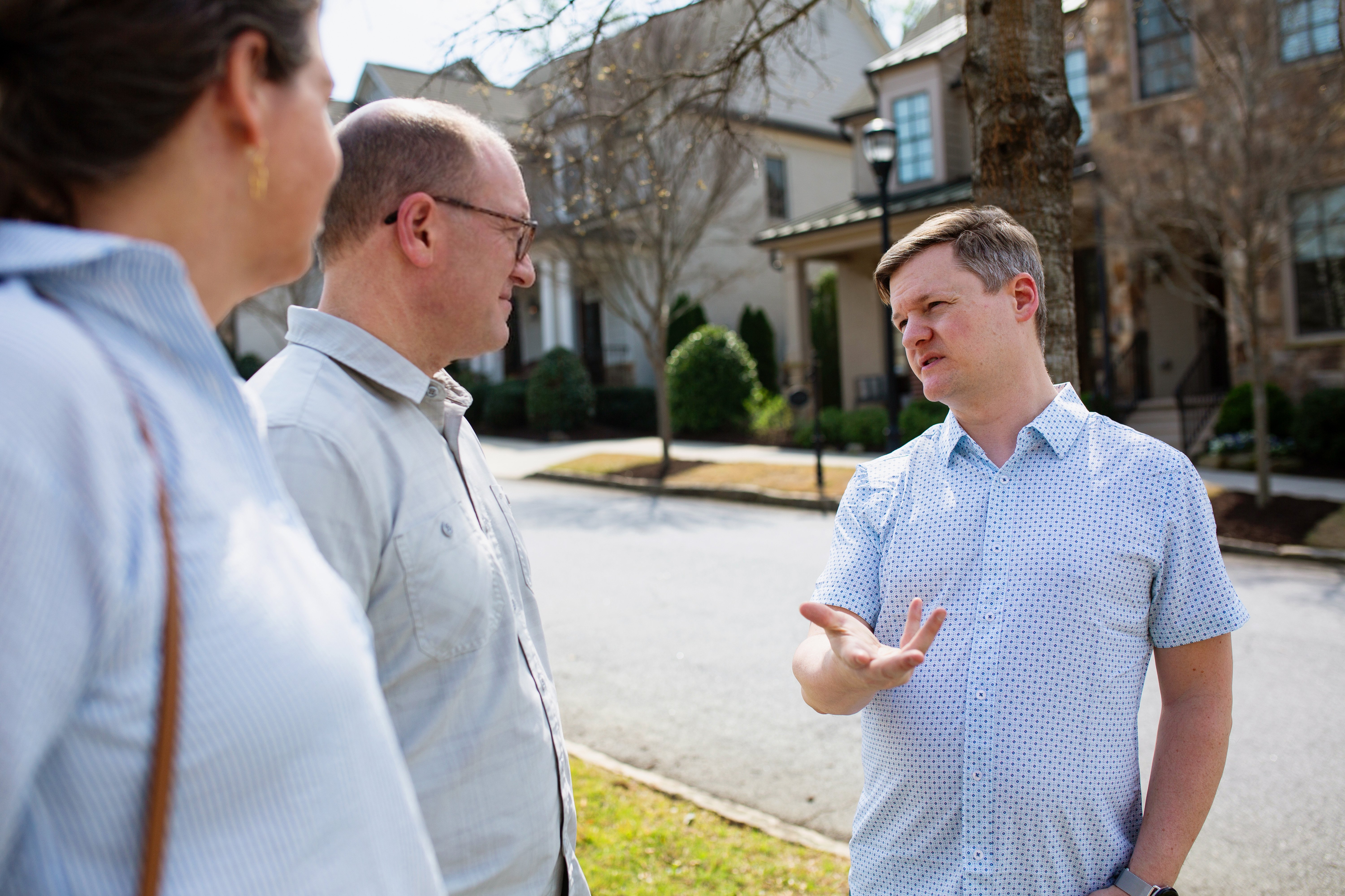 Tim Dorr discussing housing with families and a developer